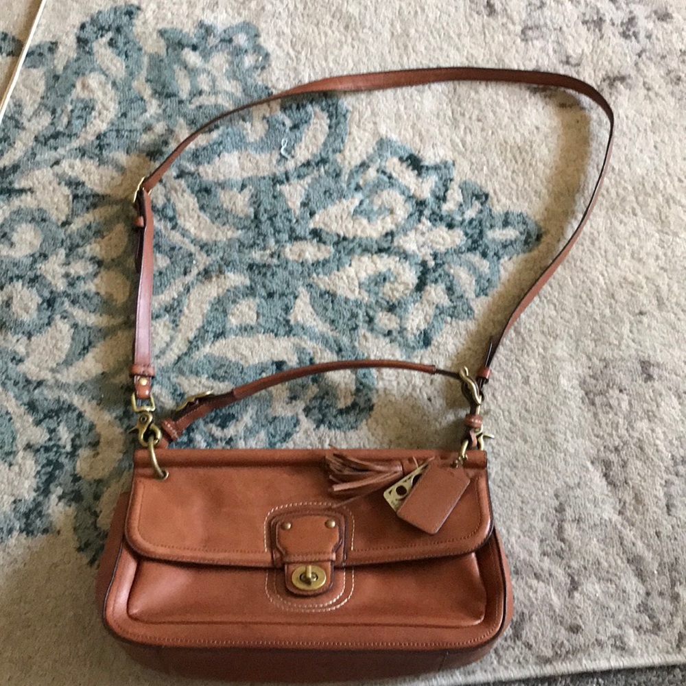 Coach purse with adjustable strap.